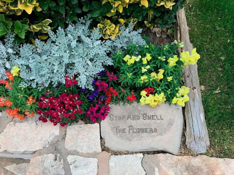 A sign reminding you to stop and practice gratitude during your spiritual wellness retreats.