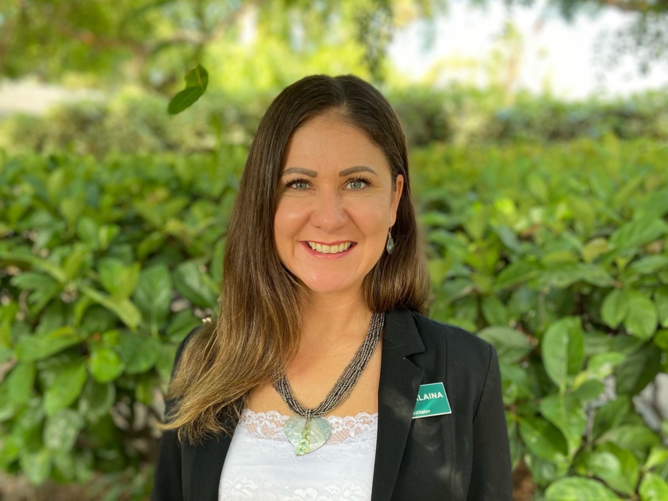 OHI facilitator, Alaina Gallegos, smiles as she welcomes you to your wellness center retreat.